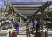 Thumbnail 38 of 42 - a patio with tables and chairs and a pergola