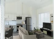 Thumbnail 14 of 29 - Open Concept Living Room to Kitchen at The Arza Apartments