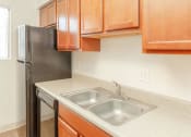 Thumbnail 11 of 24 - Stainless Steel Sink With Faucet In Kitchen at Cimarron Place Apartments, Tucson, AZ