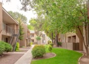 Thumbnail 14 of 24 - Courtyard With Green Space at Cimarron Place Apartments, Tucson