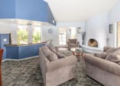 Thumbnail 17 of 24 - Clubhouse With Fireplace at Cimarron Place Apartments, Tucson, AZ