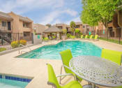 Thumbnail 21 of 24 - Poolside Relaxing Area at Cimarron Place Apartments, Arizona