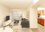 Thumbnail 5 of 24 - Classic Living Room Design With Television at Cimarron Place Apartments, Tucson, AZ