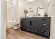 Thumbnail 22 of 48 - Bathroom with Dark Features at The Arza Apartments