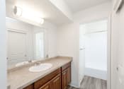 Thumbnail 13 of 20 - Modern Split Bathroom with Large Closet  at River Oaks Apartments & Townhomes, Hanford, California