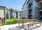 Thumbnail 28 of 33 - Courtyard With Bbq Area And Lush Gardens at Four Seasons at Southtowne Apartments, Utah, 84095