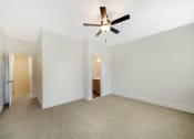 Thumbnail 12 of 23 - Bedroom with Ceiling Fan at Orchard Park Townhomes