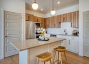 Thumbnail 3 of 40 - Brown Cabinets in Kitchen at Amara