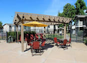 Thumbnail 12 of 26 - Shaded Outdoor Courtyard Area at Aspen Park Apartments, Sacramento, California