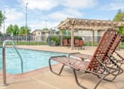 Thumbnail 3 of 26 - Poolside Relaxing Area at Aspen Park Apartments, California, 95823