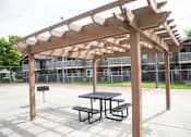 Thumbnail 19 of 26 - Shaded Outdoor Courtyard Area at Aspen Park Apartments, Sacramento