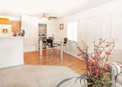Thumbnail 21 of 26 - Living Room With Kitchen View at Aspen Park Apartments, Sacramento, CA
