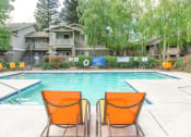 Thumbnail 12 of 15 - Pool Side Relaxing Area With Sundeck at Bent Tree Apartments, Sacramento