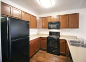 Thumbnail 11 of 24 - Modern Kitchen With Custom Cabinet at Creekside Villas Apartments, San Diego, 92102