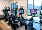 Thumbnail 16 of 23 - Cardio Machines in Fitness Center at Ridge View Apartments (MA)