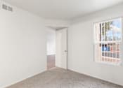 Thumbnail 11 of 22 - Carpeted Bedroom in Rio Seco Apartments