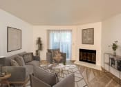 Thumbnail 7 of 21 - Living Room with Fireplace at Chesapeake Commons Apartments
