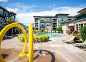 Thumbnail 24 of 38 - Extensive Resort Inspired Pool Deck and Splash Pad  at Avena Apartments, Thornton