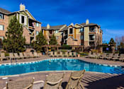 Thumbnail 19 of 30 - Pool With Sun Deck at Indigo Creek Apartments, Thornton, Colorado