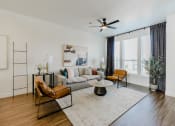 Thumbnail 9 of 61 - Spacious Living with Woodgrain Flooring at Parc at Day Dairy Apartments and Townhomes, Draper
