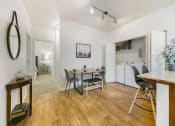 Thumbnail 4 of 23 - Dining and Kitchen Area at Falls at Riverwoods