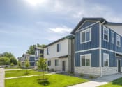 Thumbnail 1 of 23 - Exterior View of Orchard Park Townhomes