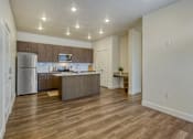 Thumbnail 10 of 20 - Empty Open Concept Living Room and Kitchen at Orchard Park Apartments