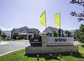 Thumbnail 30 of 33 - Elegant Entry Signage & Flags at Four Seasons at Southtowne Apartments, South Jordan, 84095