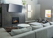 Thumbnail 25 of 33 - Quaint Fireplace Sitting Area In Clubroom at Four Seasons at Southtowne Apartments, South Jordan, 84095