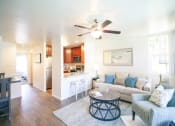 Thumbnail 5 of 42 - Living Room with Kitchen View at Canyon Club Apartments, Oceanside, CA