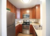 Thumbnail 9 of 42 - Fully Equipped Kitchen at Canyon Club Apartments, Oceanside, California