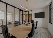 Thumbnail 40 of 85 - A conference room with a long table and chairs.