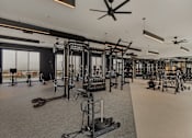 Thumbnail 23 of 85 - A spacious gym with a variety of equipment and a ceiling fan.