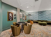 Thumbnail 47 of 85 - A room with a round table and chairs with a carpet on the floor.