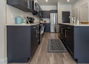 Thumbnail 3 of 48 - Island in Kitchen at The Arza Apartments