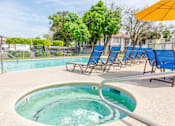 Thumbnail 16 of 20 - Luxurious Hot Spa & Pool with Lounges at River Oaks Apartments & Townhomes, Hanford, California