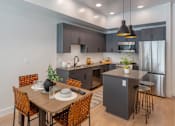Thumbnail 2 of 34 - Kitchen and Dining at Maye House Apartments
