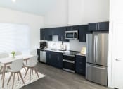 Thumbnail 12 of 29 - Kitchen in Carriage Apartment at The Arza Apartments