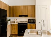 Thumbnail 6 of 25 - Updated Kitchen at Meadows at Homestead Logan UT