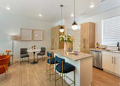 Thumbnail 6 of 39 - Modern Kitchen with Center Island at The Austin Townhomes, Draper, UT 84020
