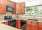 Thumbnail 10 of 21 - Electric Range In Kitchen at Chesapeake Commons Apartments, Rancho Cordova, CA, 95670