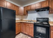 Thumbnail 9 of 18 - Kitchen with Black Appliances at Peppertree