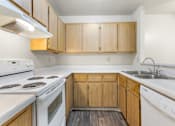 Thumbnail 7 of 22 - Kitchen with White Appliances at Rio Seco Apartments