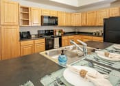 Thumbnail 9 of 33 - Kitchen and Island at Four Seasons at Southtowne Apartments, Utah
