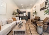 Thumbnail 4 of 48 - Living Room and Kitchen at The Arza Apartments
