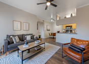 Thumbnail 3 of 30 - Living Room with Ceiling Fan at Indigo Creek, CO
