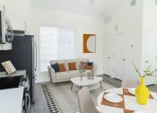 Thumbnail 16 of 29 - Comfy Dining and Living Area at The Arza Apartments
