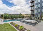 Thumbnail 14 of 42 - Lounge Chairs by Pool at City Lofts Apartments