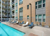 Thumbnail 14 of 46 - Lounge Seating by Pool at Arcadia Apartments