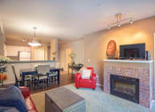 Thumbnail 10 of 30 - Living Room With Kitchen View at Metropolitan Place Apartments, Renton, 98057